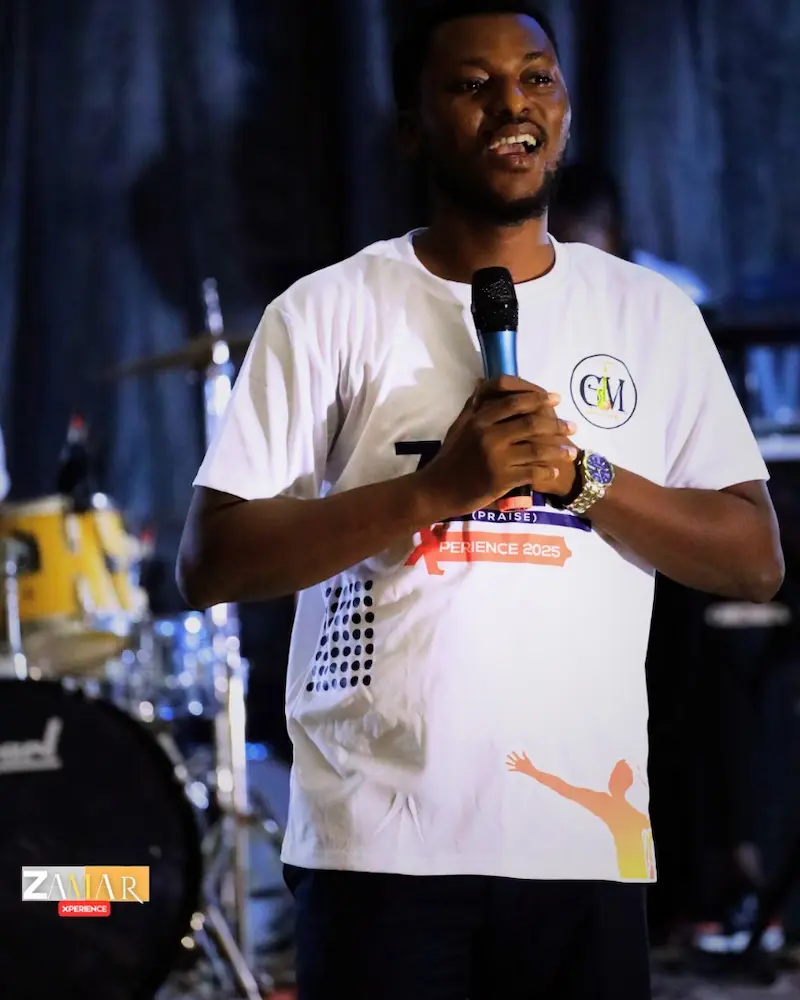 “Pastor Isaac ministering at a youth prayer event.”