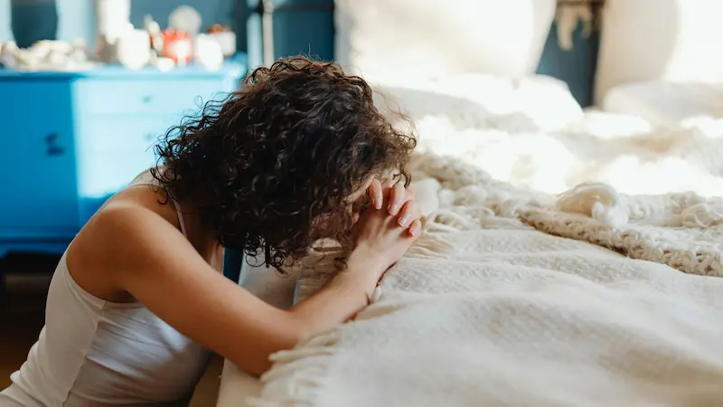 Young woman praying in the morning"