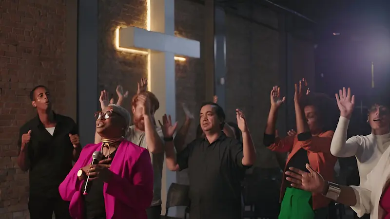 Group of people worshiping God together in unity.