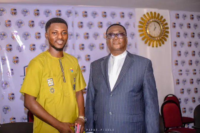 Apostle Isaac Rockefeller Asamoah standing with a ministry leader after a ministerial ordination ceremony
