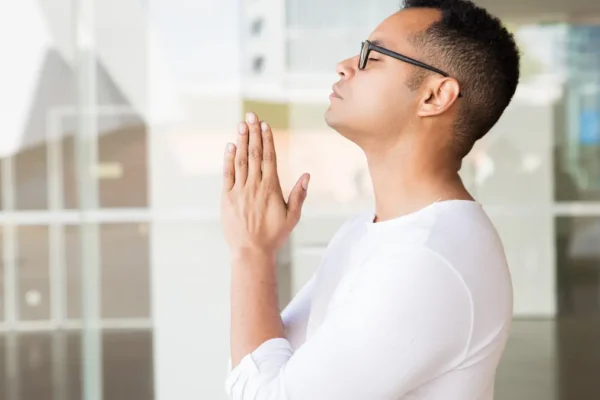 “Finding peace through prayer in quiet reflection.”