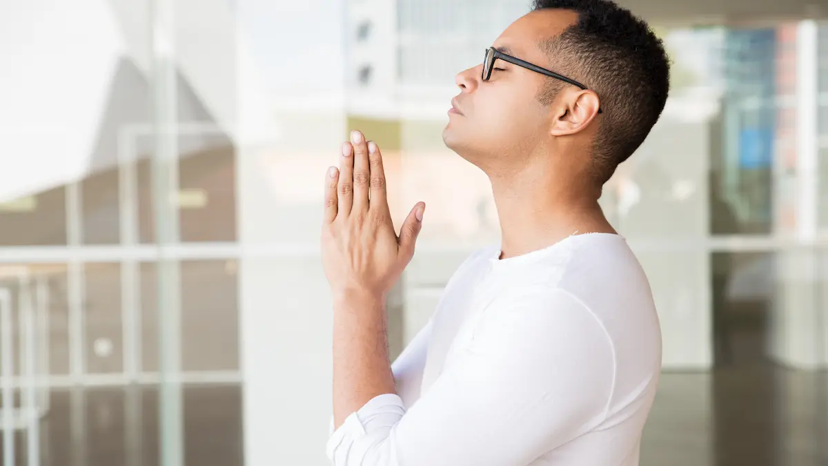 “Finding peace through prayer in quiet reflection.”
