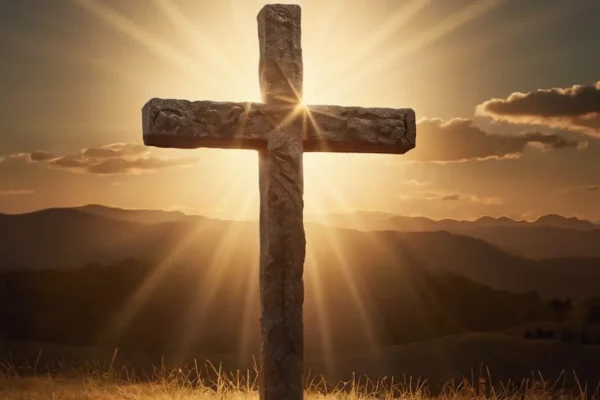 A cross illuminated by light, symbolizing hope and grace for those worried about unforgivable sin.