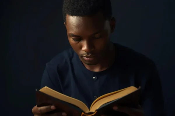 Christian studying theology with Bible for spiritual growth